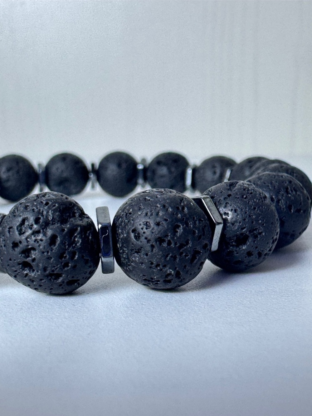 J. Element Co. Studio™: Beaded Lava Bracelet with Titanium Hematite Spacers 10mm